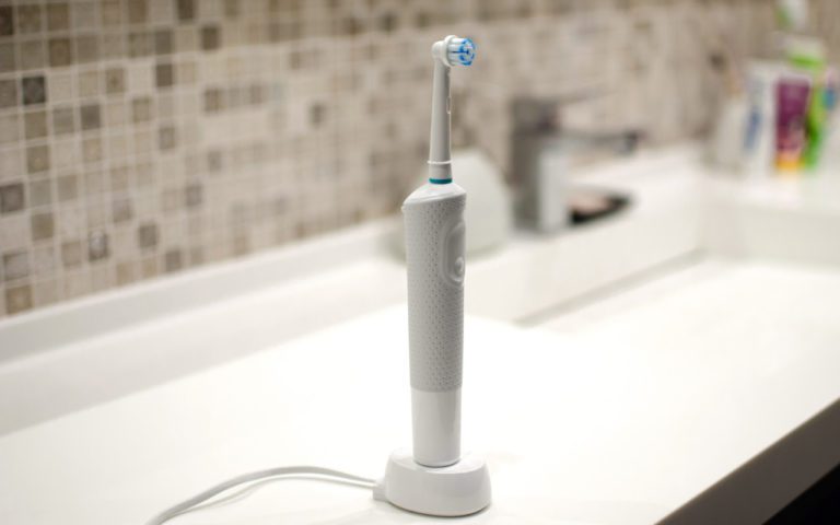 using an electric toothbrush
